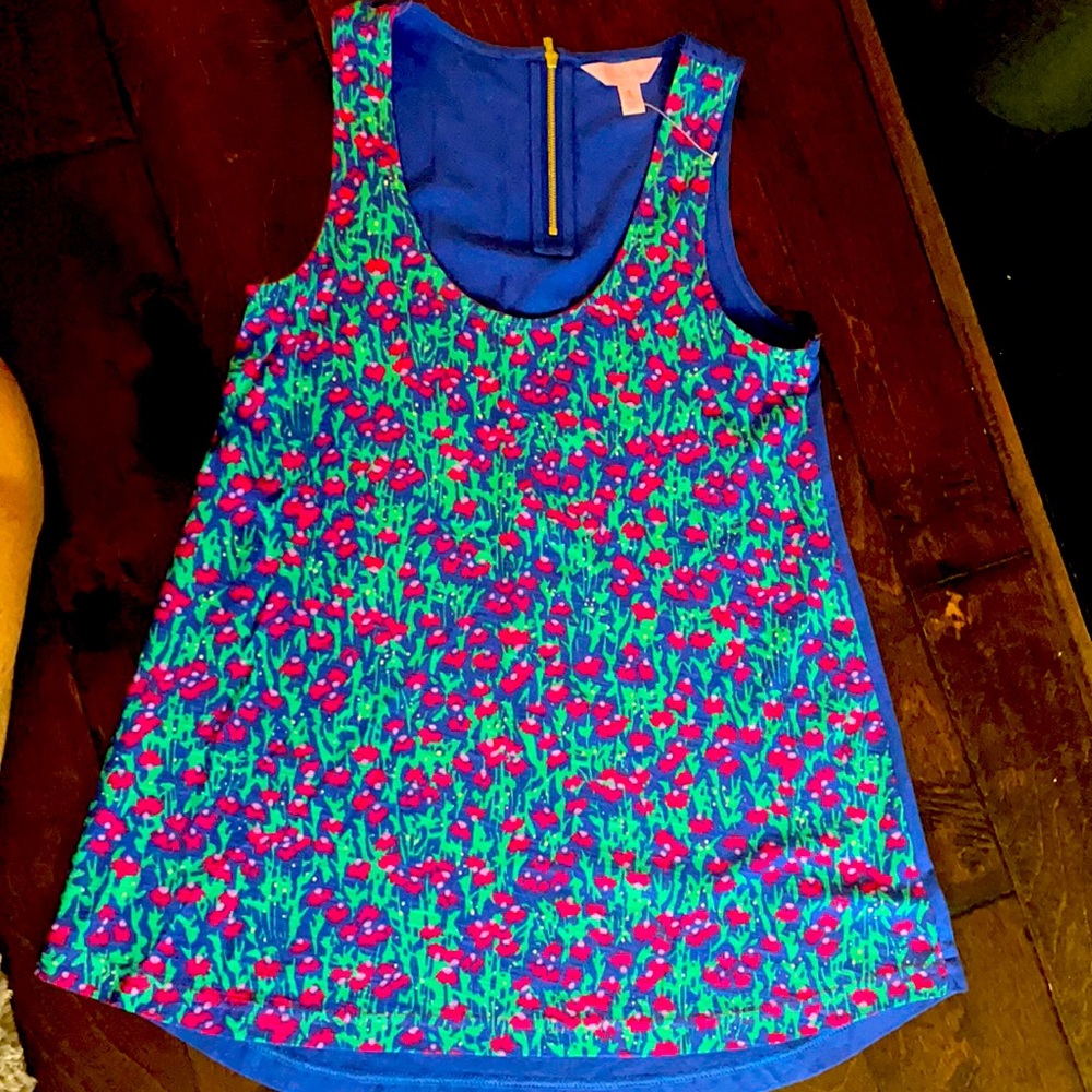 Floral tank top ,gold zipper on back. Never  worn.
